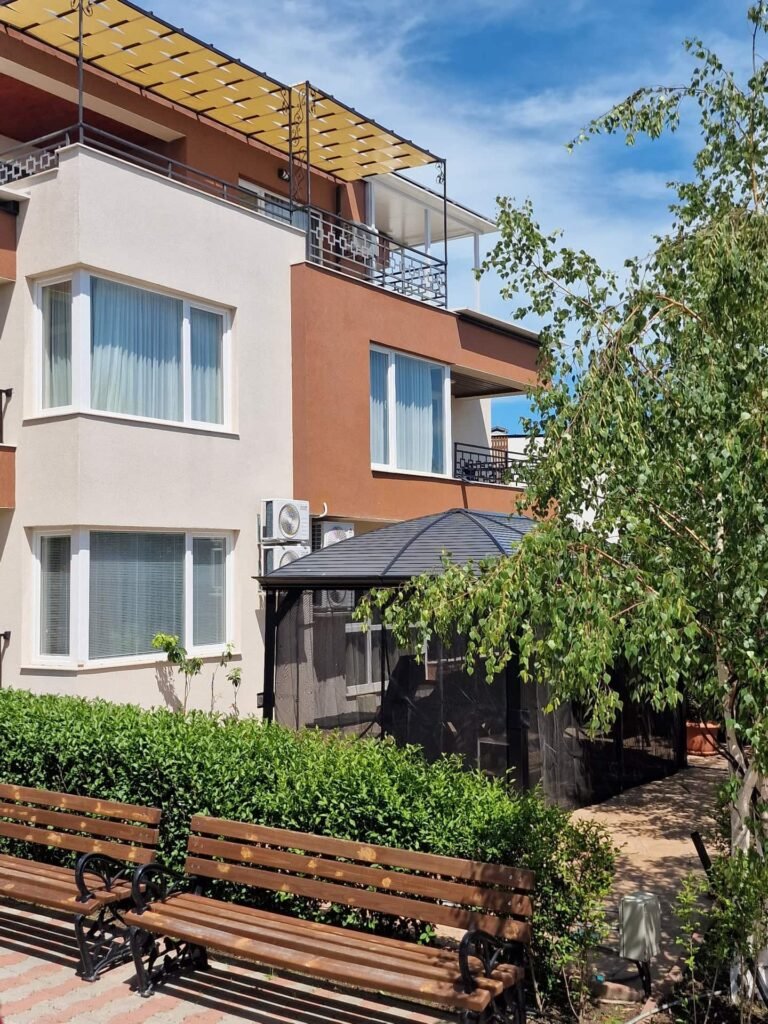 Sunny lawn and greenery at Ferano Beach Apartments, Nessebar